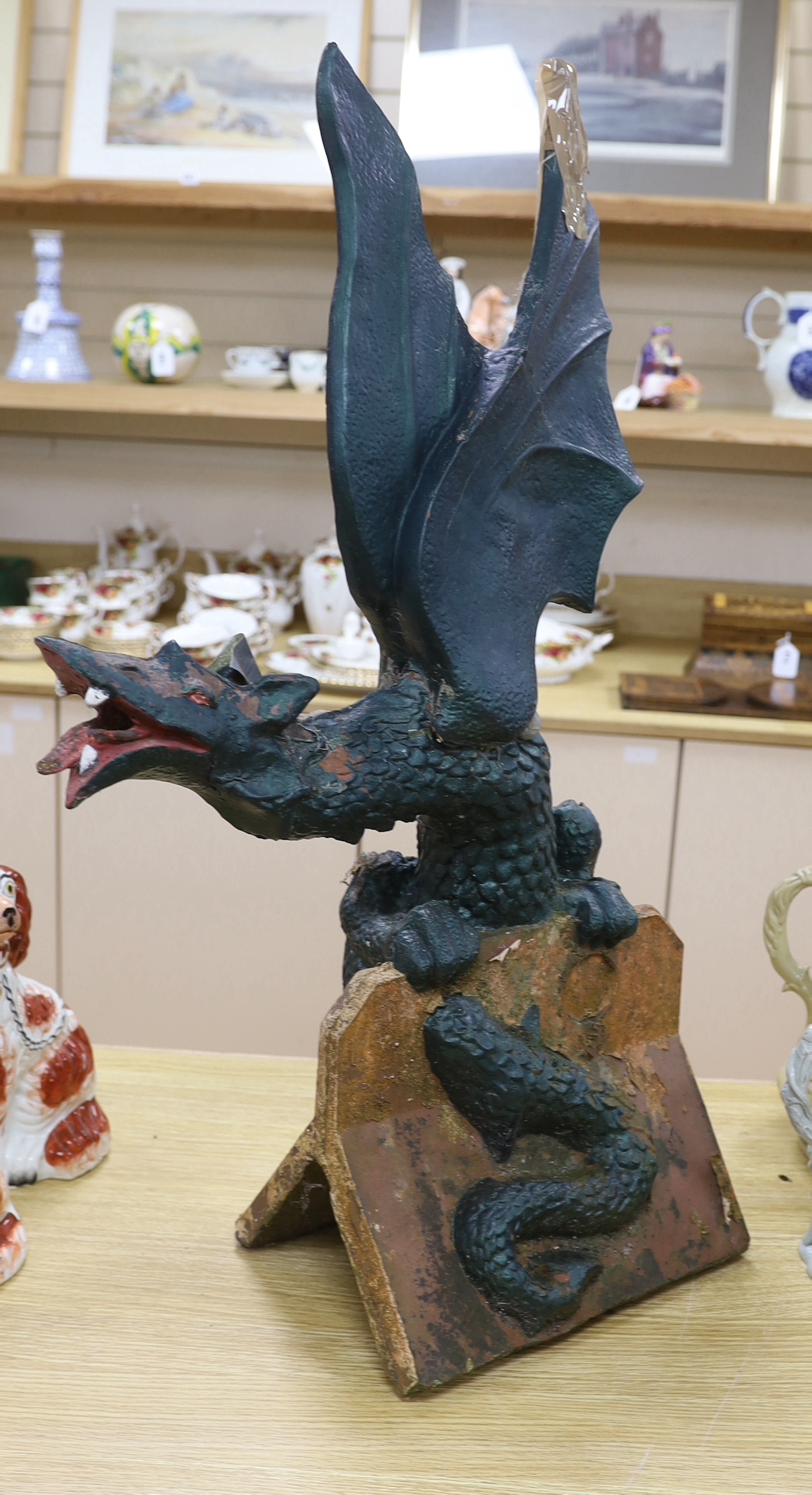 A Chinese green painted terracotta ridge tile in the form of a dragon, 80cm high (af)